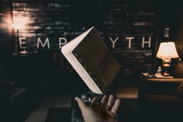 Person holding a levitating book