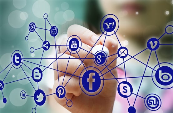 2016 Facebook Video Statistics - Girl Pointing At Facebook Logo