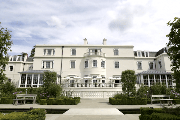 A large white stately home in England