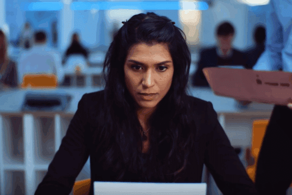 Woman focused while typing on an old fashioned typewriter
