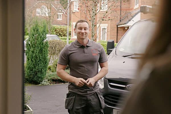 Boiler repair man entering house