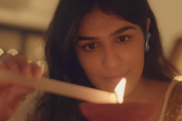 woman lighting candle