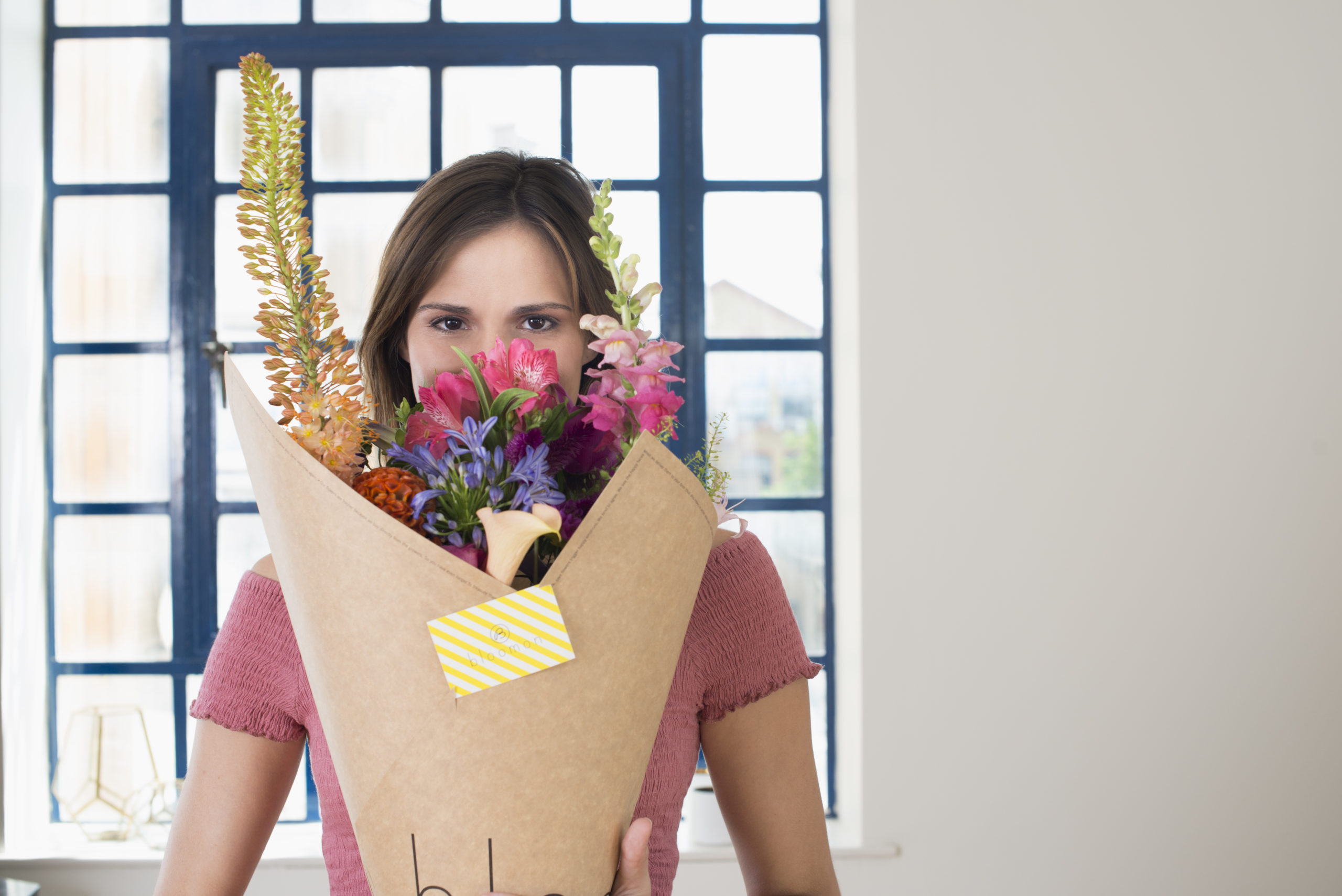 woman holding a bunch of flowers