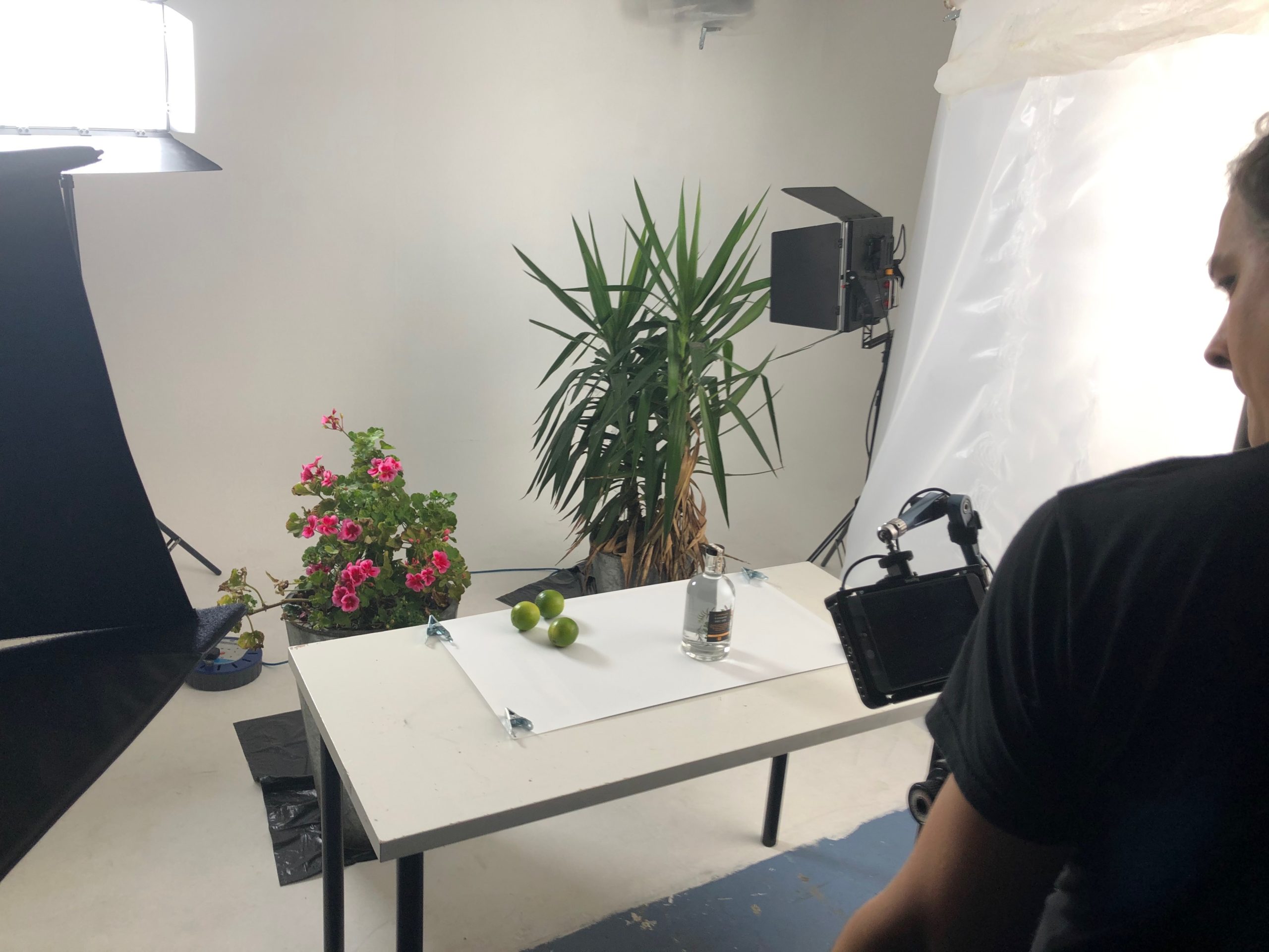cameraperson in studio with video camera