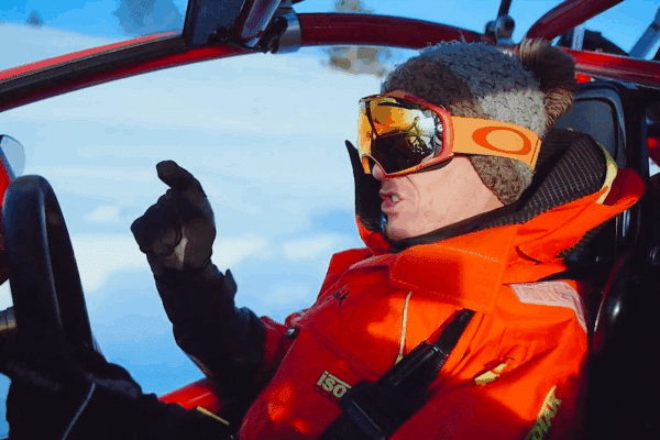 man driving a snowmobile