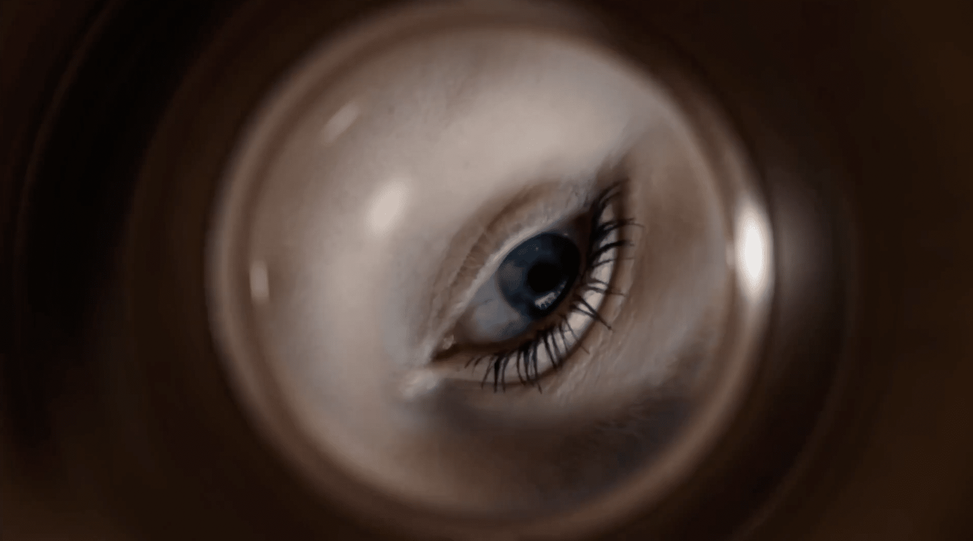 An eye looking down a tube